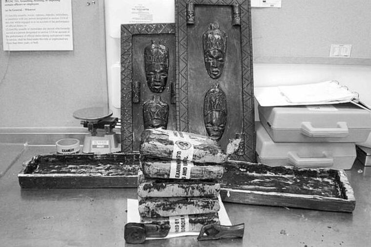 Something didn't seem right, so officers X-rayed and bored into these African art pieces and discovered a green substance, a spokesman said.