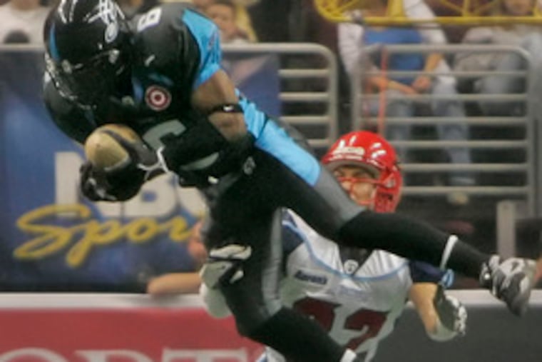 The Soul's Eddie Moten aims for an interception in front of the Los Angeles Avengers' Greg Hopkins. The Philadelphia team is 4-0, but about to be tested by two of the league's best teams.