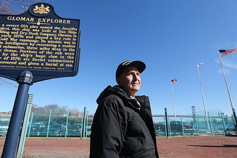 John Lahm with the Glomar Explorer marker at Penn's Landing. He wants to bring the spy ship to the waterfront, near where it was built in Chester. DAVID SWANSON / Staff Photographer