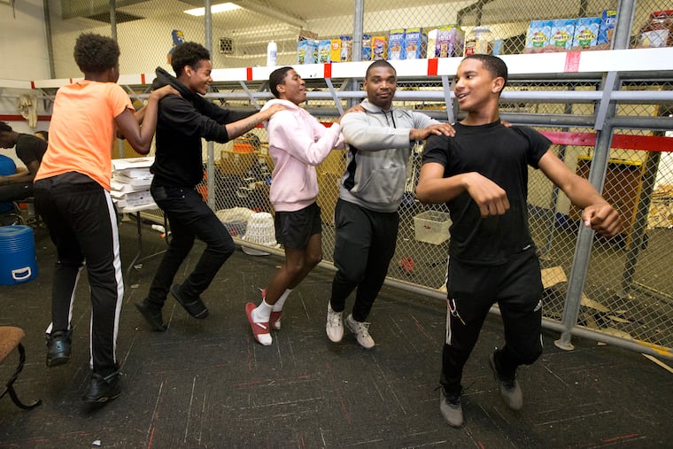 Frankford football coach Bill Sytsma invites his players to spend Friday nights together in the locker room during the spring and summer months to avoid any trouble out on the streets. A group of players do a dance on June 7, 2019. The dancing started when the coach played "Elvira" by the Oak Ridge Boys featuring Frankford graduate Joe Bonsall.