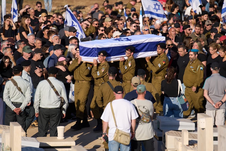 Israeli soldiers carry the casket of Staff sergeant Noam Hamburger, who was killed in a Lebanese drone attack on northern Israel, during his funeral in Atlit, Israel, Sunday, May 24, 2026.