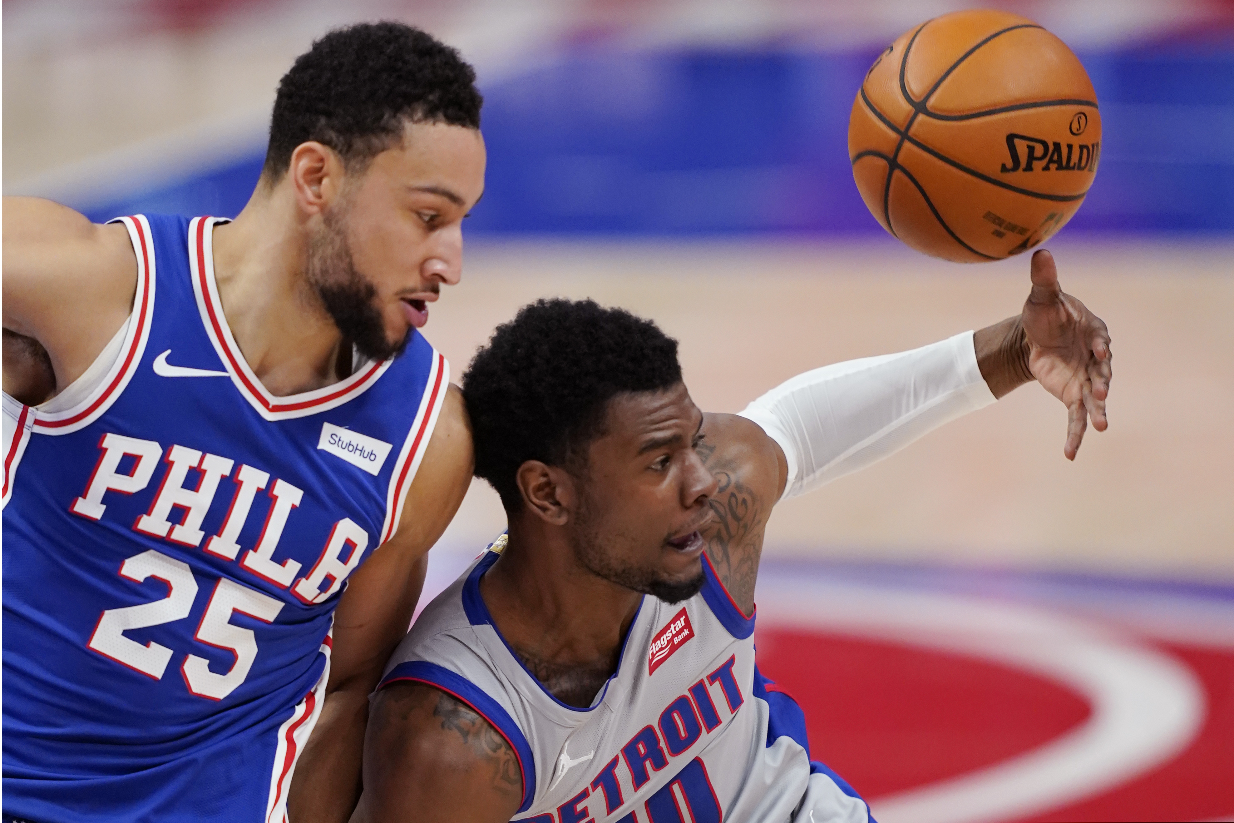Detroit Pistons guard Josh Jackson (20) loses control of the ball next to Philadelphia 76ers guard Ben Simmons (25) during the second half of Monday's game.