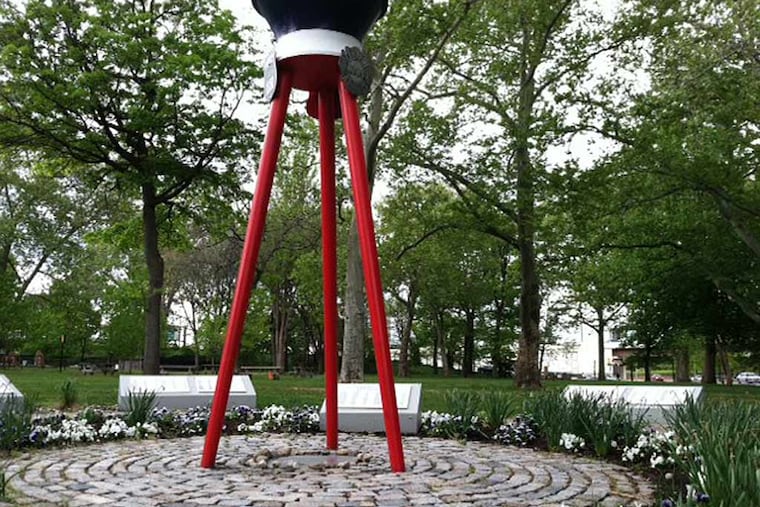 A memorial in Franklin Square park honors police and firefighters who
have died in the line of duty. An organization is raising money to
build a new memorial. Daily News Staff / Morgan Zalot