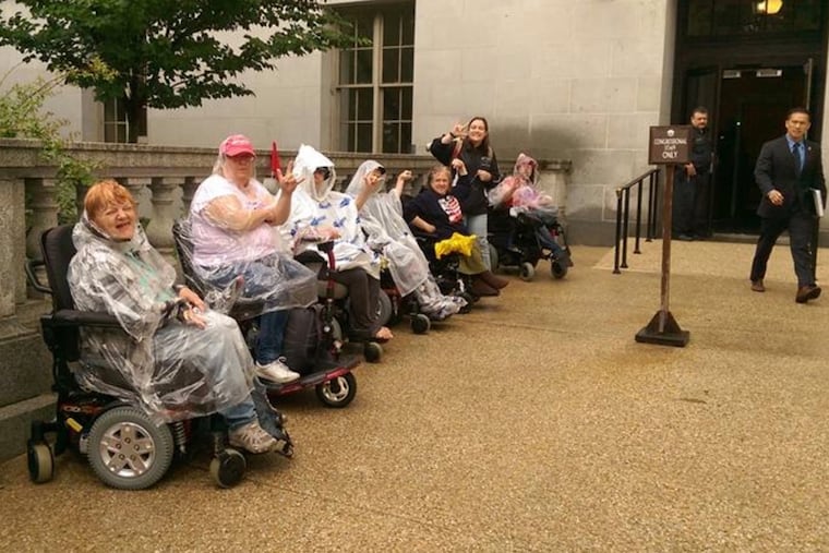 Kathryn Blaker (front) sits with other disability advocates outside of an elected official's office to advocate for the right of people with disabilities in 2020. In Pennsylvania, people with disabilities represent more than 17% of the electorate.