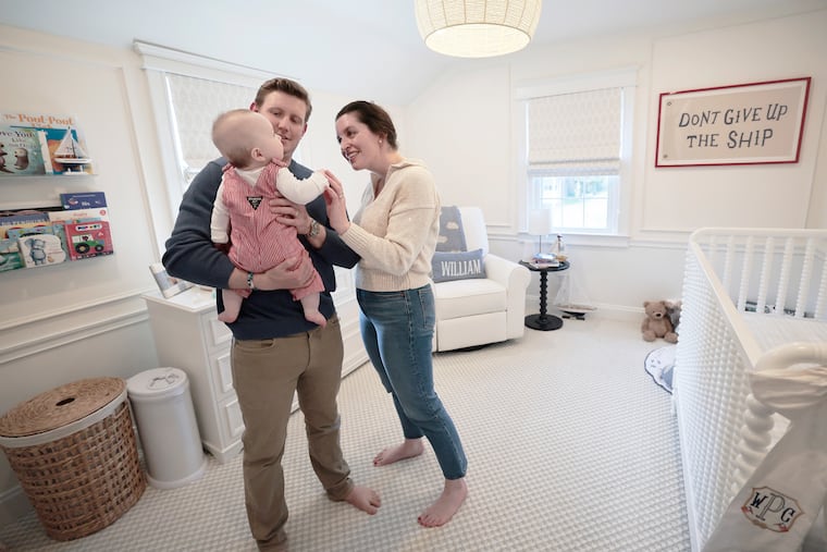 Pediatrician Curran Reilly Peacher credits NIH research and her son with saving her life after she was diagnosed with cancer during pregnancy. Shown here with baby Will Peacher, age 6 months, and his father, Tommy Peacher, at their home in Havertown.