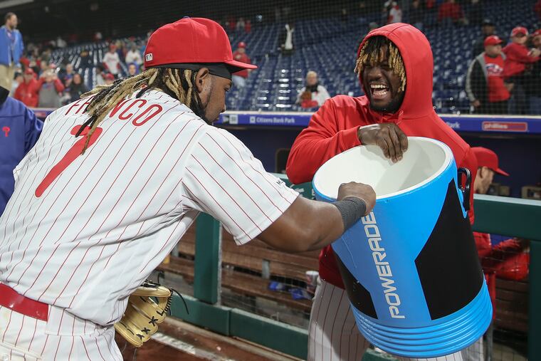 Maikel Franco blocks teammate Odubel Herrera from dousing him with water after the Phillies' 7-3 victory over the Detroit Tigers on Wednesday night at Citizens Bank Park.