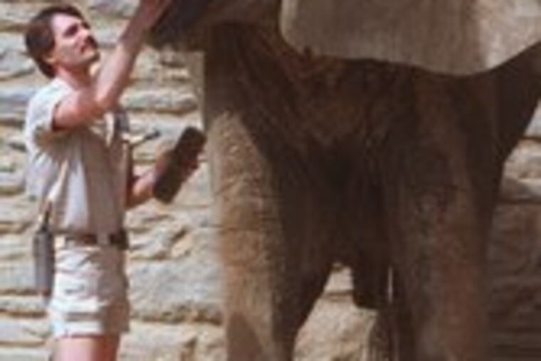 Petal, with handler Mark Grunwald, at the zoo in 2006.
