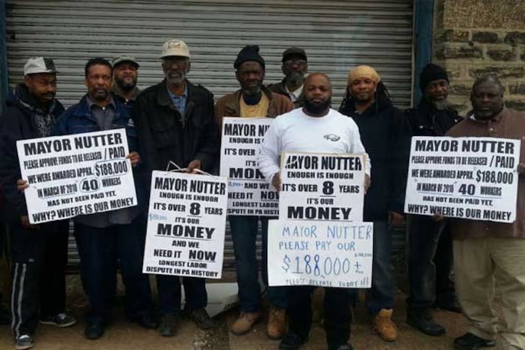 These are just some of the men still waiting after 10 years to be paid for work they did for the city. (Photo by Vernon Ray)