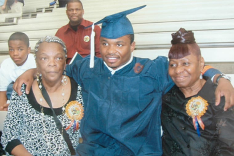 A photo of NFL prospect Curtis Brinkley with his two grandmothers at his Syracuse graduation. This picture was found in the home of his grandmother, Margie Cason.