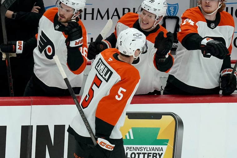 Flyers' Egor Zamula returns to the bench after scoring during the first period against the Penguins.