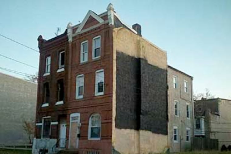 pmural29. 2d photo with PMURAL: The site of the Dox Thrash mural after it was obliterated.
Someone recently painted out an important and beautiful mural, Tribute to Dox Thrash, at 24th & Cecil B Moore.
This mural was painted in 2001 by Eric Okdeh & Cavin Jones, and honors the work and life of African-American printmaker Dox Thrash, who invented the carbodundum mezzotint printmaking process. It's a part of our African American Iconic Images Collection & audiotour, narrated by Questlove. We're pretty shocked & are trying to find out who did this & why -- it seems possible it was related to the property going into HUD foreclosure.