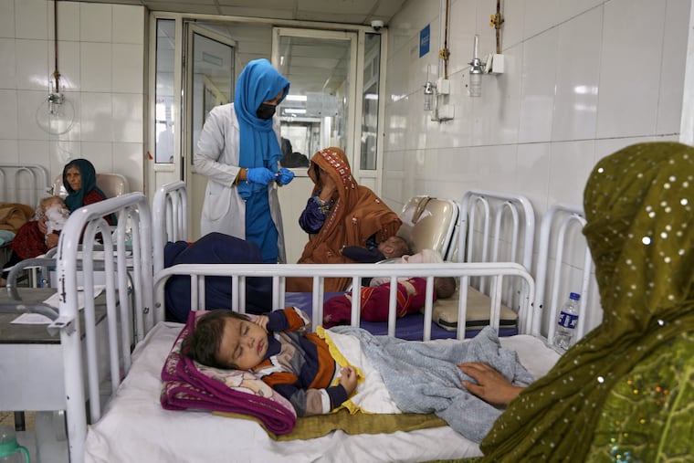 Afghan women care for their children in the malnutrition ward at Indira Gandhi Children's Hospital in Kabul, Afghanistan, Feb. 15, 2026.