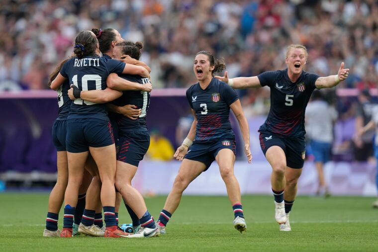 The United States team celebrates after winning the bronze medal with a rugby sevens win over Australia.