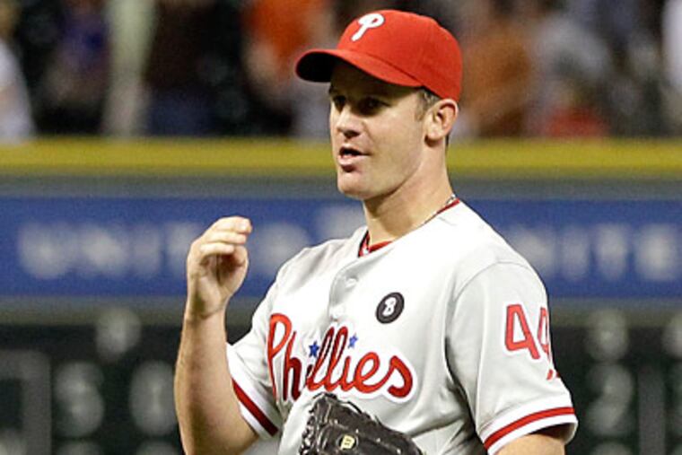 Roy Oswalt allowed five earned runs in seven innings against the Astros. (David J. Phillip/AP)