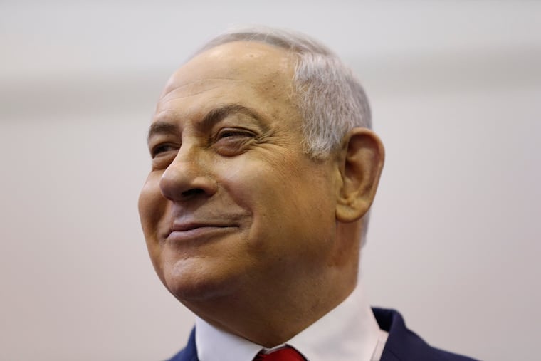 Israel's Prime Minister Benjamin Netanyahu smiles after voting during Israel's parliamentary elections in Jerusalem, Tuesday, April 9, 2019 (AP Photo/Ariel Schalit, Pool)