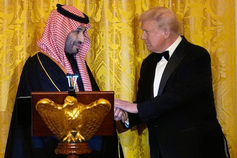 President Donald Trump shakes hands with Saudi Arabia's Crown Prince Mohammed bin Salman during a dinner in the East Room of the White House on Tuesday, Nov. 18.