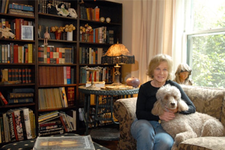Frances Shultz's and her dog Bettie in the front living room with library of her home in Lansdowne.(Ron Tarver / Staff Photographer)