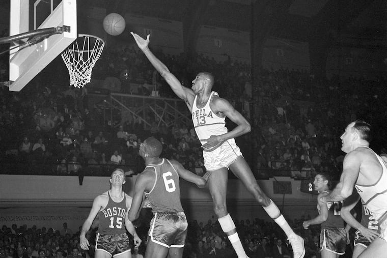 Wilt Chamberlain lays the ball in over Bill Russell during Game 3 of the 1960 NBA Eastern division finals against the Celtics. The uniform up for auction from that season was worn twice during that series, in Games 4 and 6.