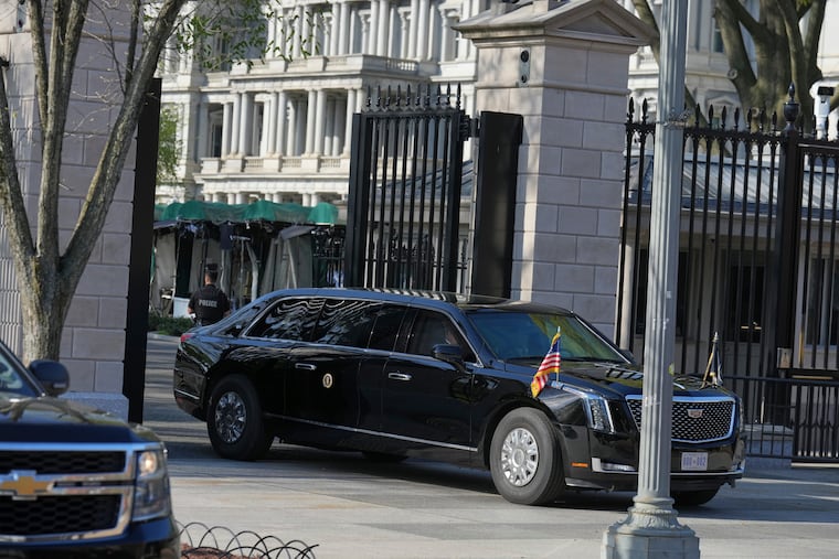 President Donald Trump's limo exits the White House en route to the Supreme Court on Wednesday in Washington.