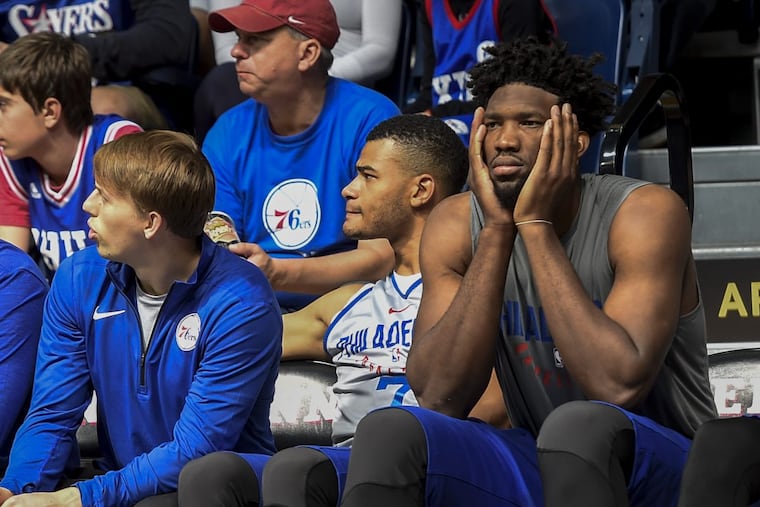 Joel Embiid (right) still has not been cleared for full five-on-five scrimmages.