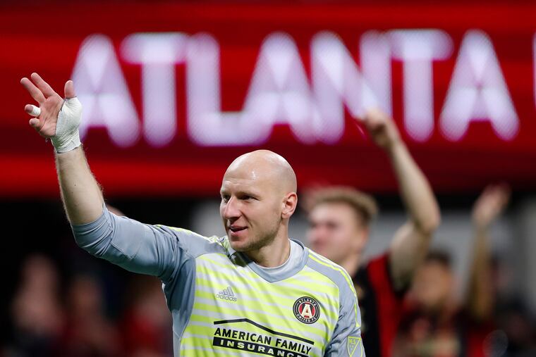 Atlanta United goalkeeper Brad Guzan waves to the crowd after defeating New York City FC in an MLS playoff soccer match Sunday, Nov. 11, 2018, in Atlanta. (AP Photo/John Bazemore)