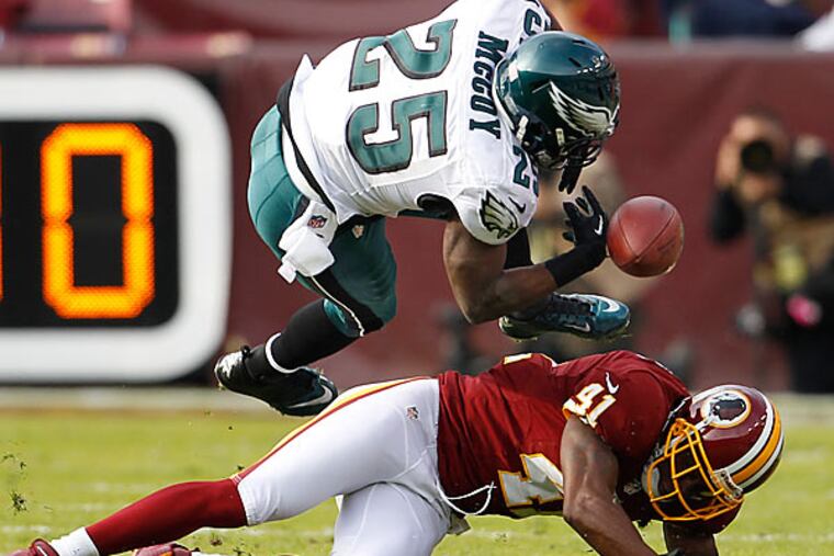 Eagles running back LeSean McCoy is upended by Redskins linebacker Madieu Williams in the first quarter. (Ron Cortes/Staff Photographer)