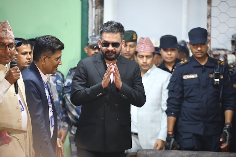 Balendra Shah, foreground, former mayor of Kathmandu Metropolitan City and prime ministerial candidate of the Rastriya Swatantra Party, arrives to receive his victory certificate in Jhapa, Nepal, Sunday, March 8, 2026.