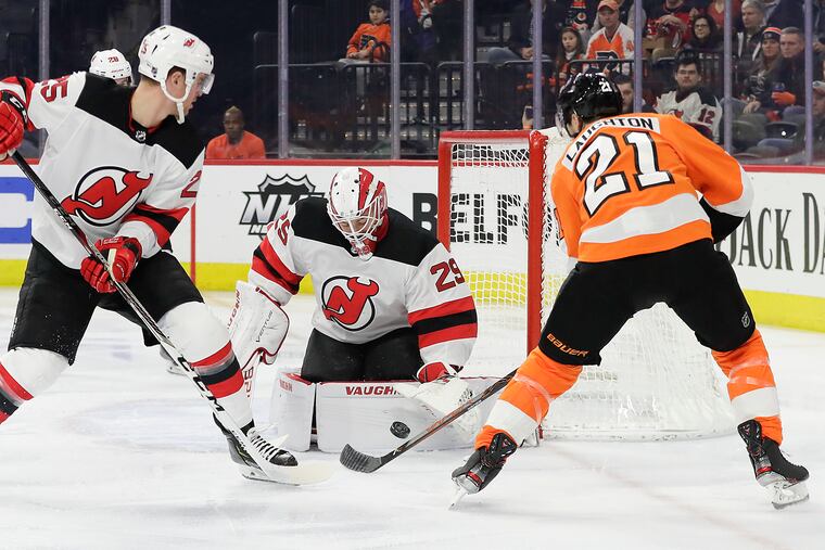 The Flyers' Scott Laughton is stopped by New Jersey Devils goaltender Mackenzie Blackwood. The Devils trounced the Flyers on Thursday night.