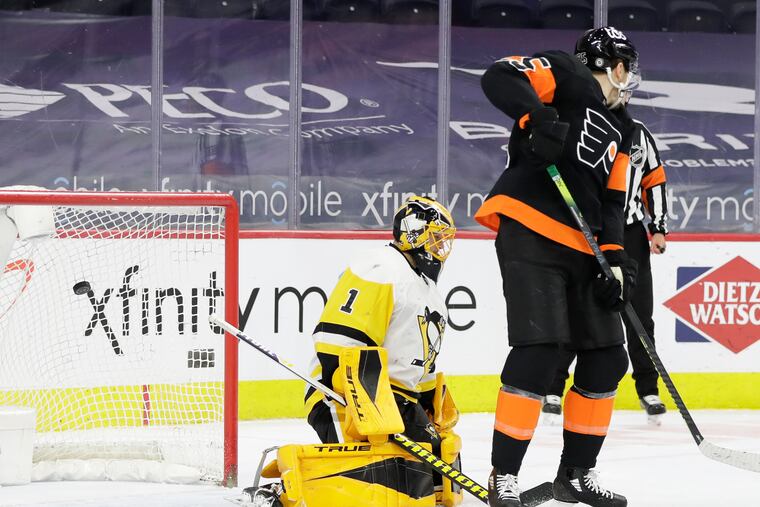 Flyers left winger James van Riemsdyk screens Pittsburgh Penguins goaltender Casey DeSmith on defenseman Shayne Gostisbehere's first-period, power-play goal.