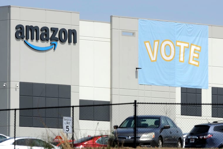 A banner encouraging workers to vote in labor balloting is shown at an Amazon warehouse in Bessemer, Ala., in March.