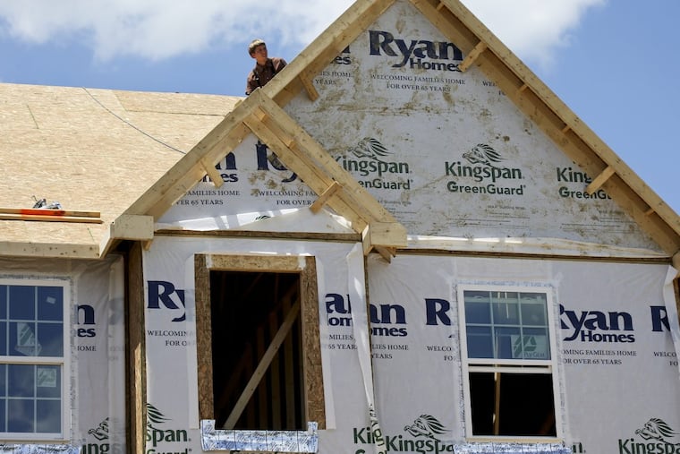 In this Thursday, June 1, 2017, photo, builders work on the roof of a home under construction at a housing plan in Jackson Township, Butler County, Pa. On Monday, Sept. 18, 2017, the National Association of Home Builders/Wells Fargo releases its September index of builder sentiment. (AP Photo/Keith Srakocic)