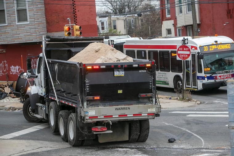 Salt trucks takes to the streets of Philadelphia after loading up with salt. Streets Department salt crews load up their trucks at Glenwood and York St. in Philadelphia on Wednesday, December 16, 2020 as the city and region prepares for a snow storm.