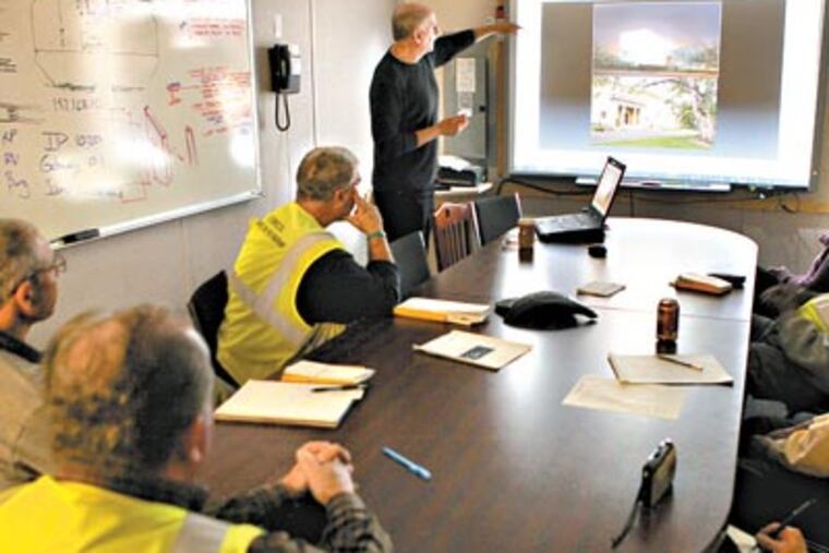Barnes Foundation instructor John Gatti leads the art class, using slide projections, for construction supervisors at the new Barnes museum site. The museum is moving from Merion to Center City. (Laurence Kesterson / Staff Photographer)