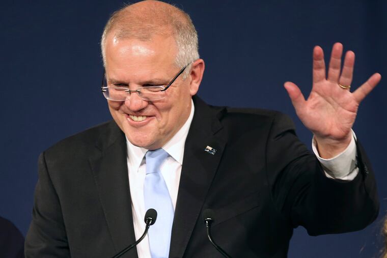 Australian Prime Minister Scott Morrison speaks to party supporters after his opponent concedes defeat in the federal election in Sydney, Australia, Sunday, May 19, 2019. Australia's ruling conservative coalition, lead by Morrison, won a surprise victory in the country's general election, defying opinion polls that had tipped the center-left opposition party to oust it from power and promising an end to the revolving door of national leaders. (AP Photo/Rick Rycroft)