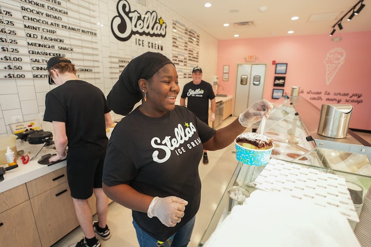 Lisa Evans, manager at Stella's Ice Cream in Fishtown, serves a brownie ice cream sandwich.