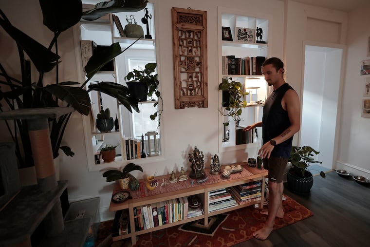 Dylan Foglesong tends to an area he calls the shrine in his home.