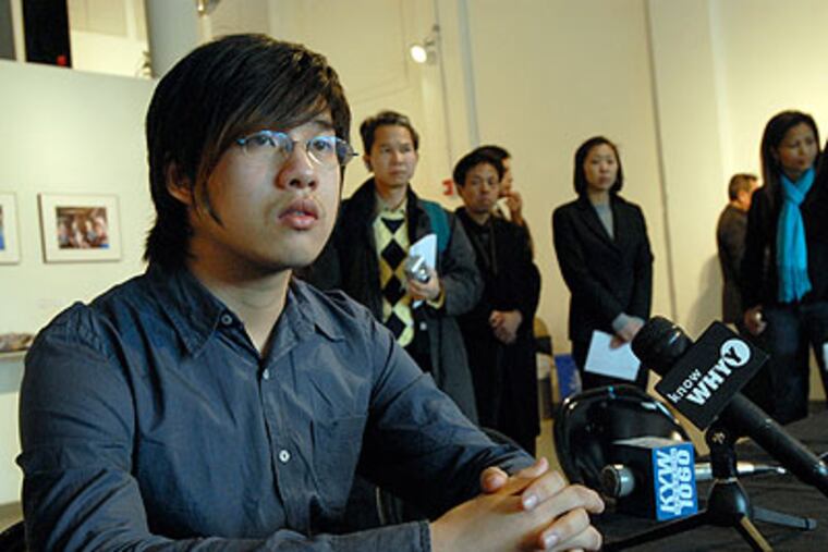 Wei Chen, a student at South Philadelphia High, addresses the media at a news conference in Chinatown earlier this month about alleged attacks at the high school. (April Saul / File photo)