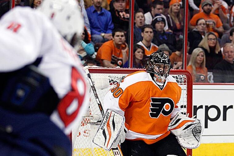 Ilya Bryzgalov livened the Flyers' morning skate on Wednesday when he exited his crease and winged his goalie stick across the ice. (Yong Kim/Staff Photographer)
