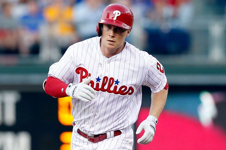 Cody Asche rounds second base after hitting a home run against the Toronto Blue Jays.