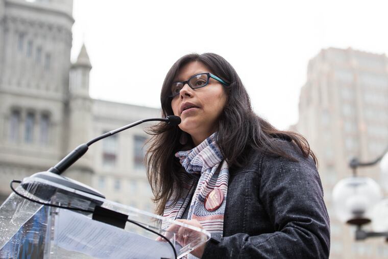 Blanca Pacheco of the Poor People's Campaign speaks to the Working People's Day of Action rally attendees on Saturday morning, February 24, 2018 at Thomas Paine Plaza.