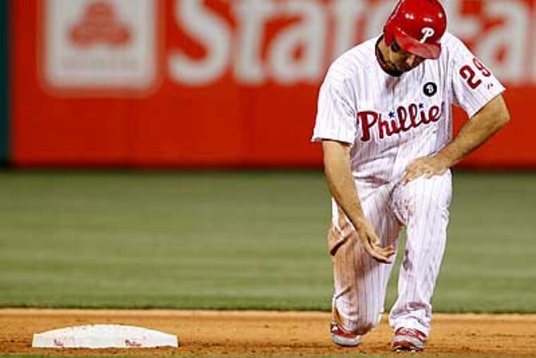 Raul Ibanez gets to his feet after Domonic Brown grounded into the game-ending double play. (Ron Cortes/Staff Photographer)