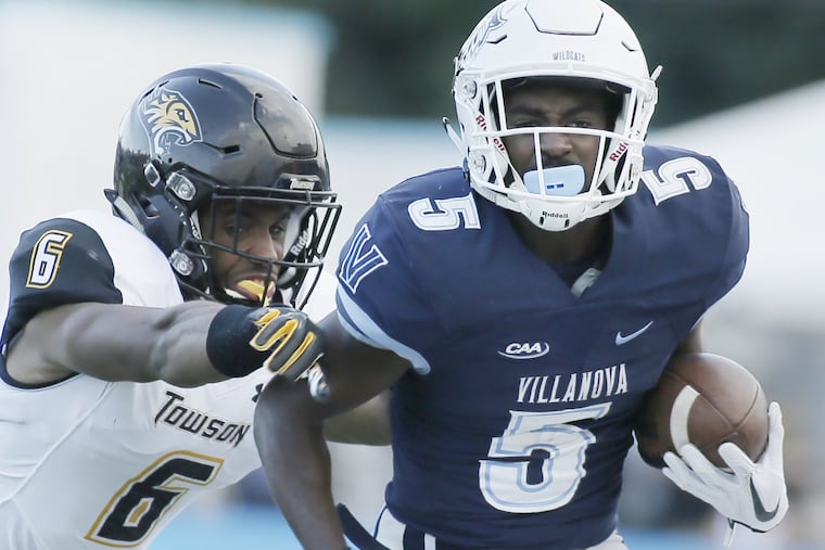 Villanova's Jarrett McClenton gets pushed out of bounds by Towson's Jamal Gay after a big gain in the third quarter on Saturday at Villanova Stadium.