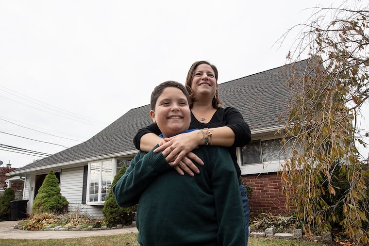 Melissa Centifonti and her 9-year-old son Ethan in front of their home in Langhorne, Bucks County. Centifonti, a real estate agent, went through Bucks County's first-time homebuyer program to buy her home in 2017.