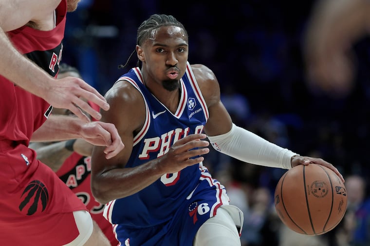 Tyrese Maxey (right) drives to the basket during a loss to the Toronto Raptors on Wednesday night.