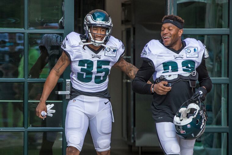 Ronald Darby, left, walking out for his first practice as an Eagle with Rodney McLeod.