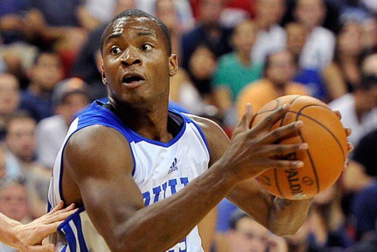 Elijah Millsap drives to the basket against the Utah Jazz during an NBA summer league basketball game on Saturday, July 12, 2014, in Las Vegas. (David Becker/AP)