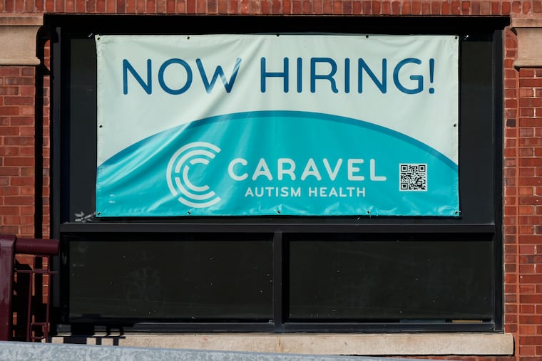 A hiring sign is displayed at a health service center in Chicago on Tuesday, Jan. 21, 2025.