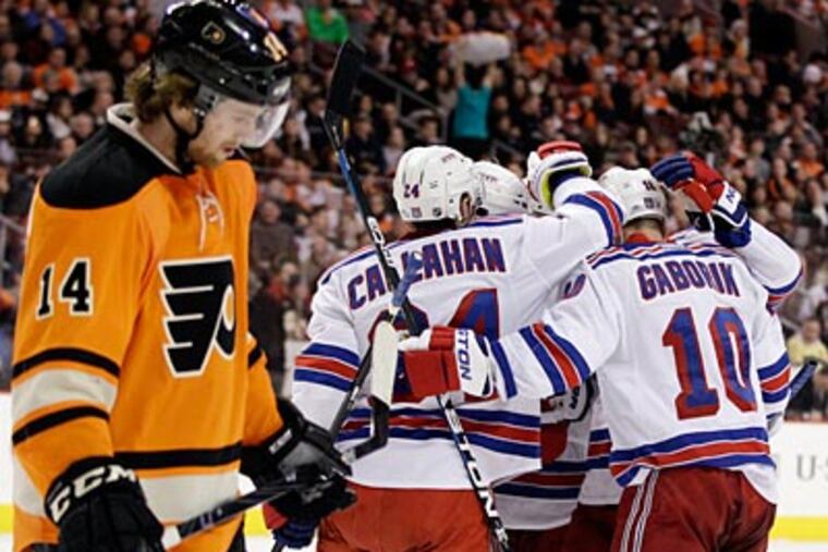 Sean Couturier and the Flyers are 3-4-3 in their last 10 games. (Matt Slocum/AP)