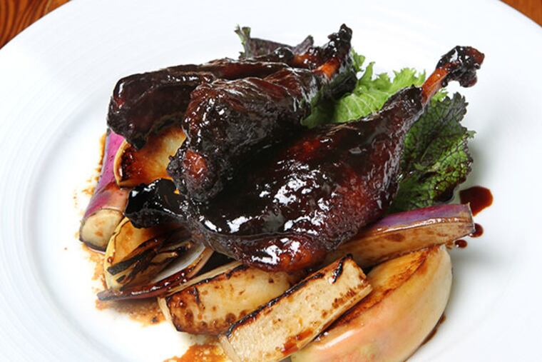 The maple-braised duck with apples and turnips at Russet. ( CHARLES FOX / Staff Photographer )