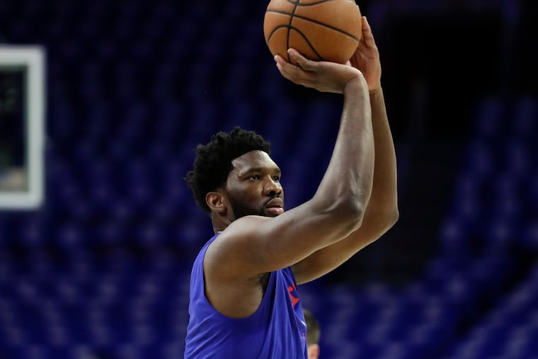 Sixers center Joel Embiid shoots the basketball warming-up before the Sixers play the Brooklyn Nets in game one of the Eastern Conference playoffs on Saturday, April 13, 2019 in Philadelphia.